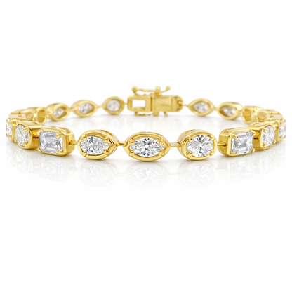 Gold bracelet with diamond accents on a white background