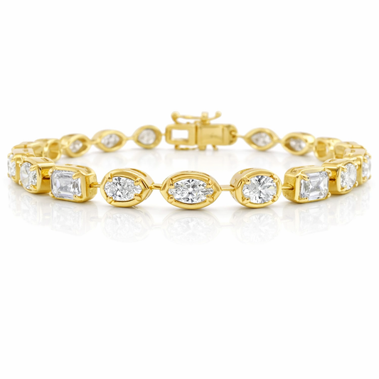 Gold bracelet with diamond accents on a white background