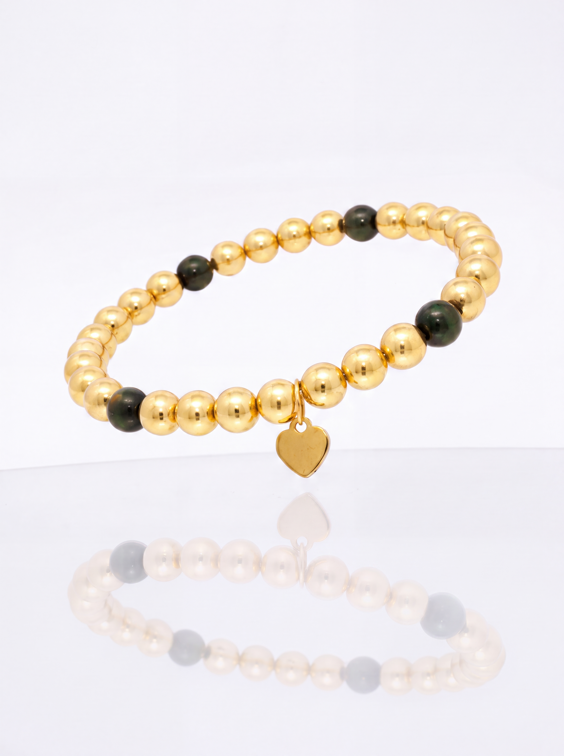 Solid 14k gold bead bracelet with black onyx station