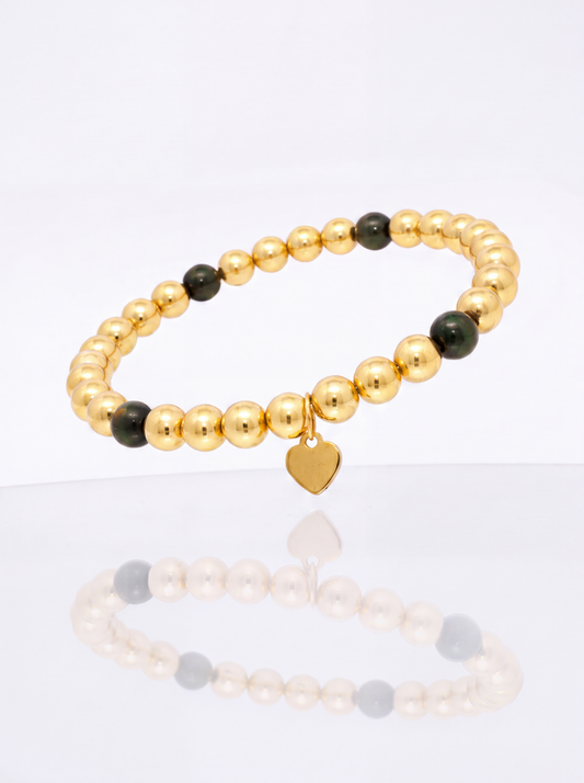 Solid 14k gold bead bracelet with black onyx station